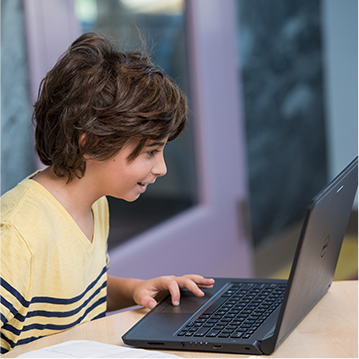 Male student using a laptop