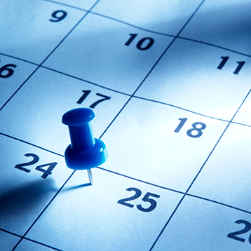Pin stuck in a calendar page